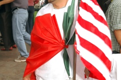 Richard Martinez has the Mexican Flag draped over his shoulders while being in the Immigration Rally held in El Paso, TX on April 10.